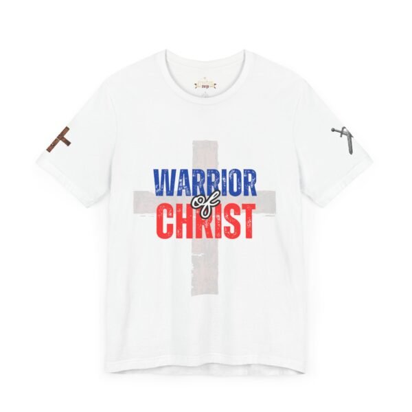 White "Warrior of Christ" T-shirt featuring a distressed cross design in brown with bold red, white, and blue typography. Christian faith apparel for proud believers.