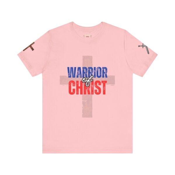 Light pink Warrior of Christ T-shirt featuring a bold cross design and patriotic red, white, and blue lettering, perfect for expressing faith and devotion.