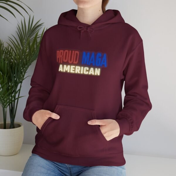 Burgundy "Proud MAGA American" hoodie with eagle and American flag graphic, featuring bold red, blue, and yellow text.