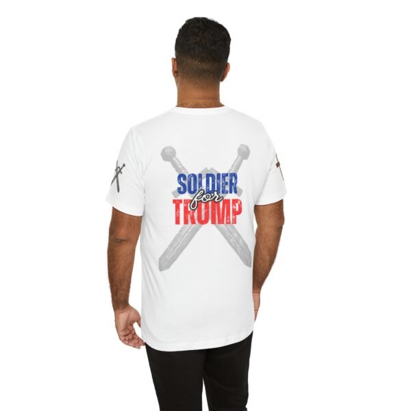 White "Soldier for Trump" T-shirt featuring crossed swords and bold red, white, and blue lettering. Patriotic apparel for conservative supporters.