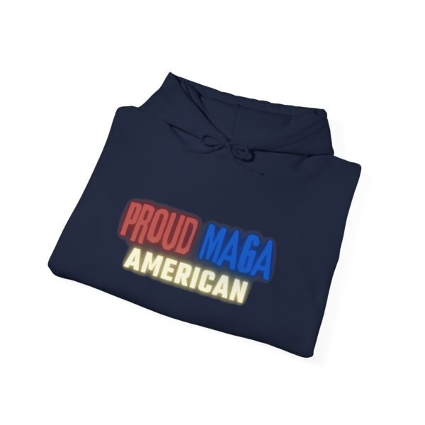 Navy blue folded "Proud MAGA American" hoodie featuring bold red, blue, and yellow text in a vibrant design, showcasing patriotism and pride.