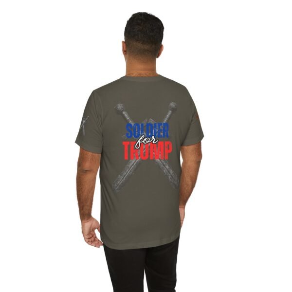 Olive green "Soldier for Trump" T-shirt featuring crossed medieval swords and bold red, white, and blue patriotic lettering. Conservative pro-Trump apparel.