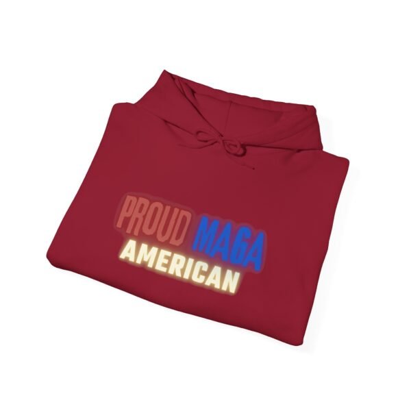 A neatly folded "Proud MAGA American" hoodie in deep red, showcasing bold lettering in patriotic colors. A stylish, comfortable, and pro-America hoodie for true conservatives.