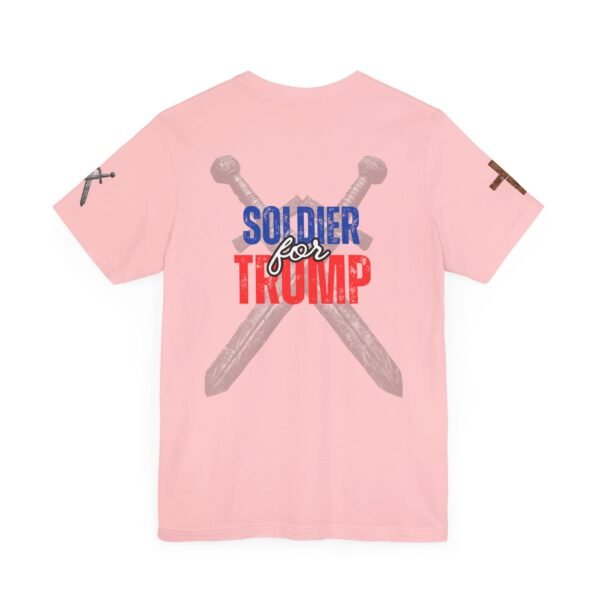 A pink Women's Soldier for Trump T-shirt featuring crossed swords and bold patriotic lettering, symbolizing conservative strength and American values.