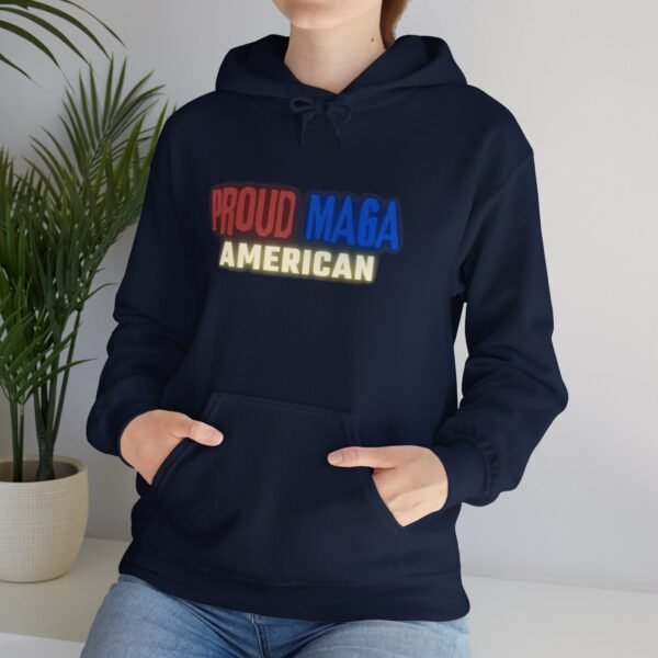 Navy blue "Proud MAGA American" hoodie with bold red, blue, and yellow text on the front, showcasing patriotic pride.